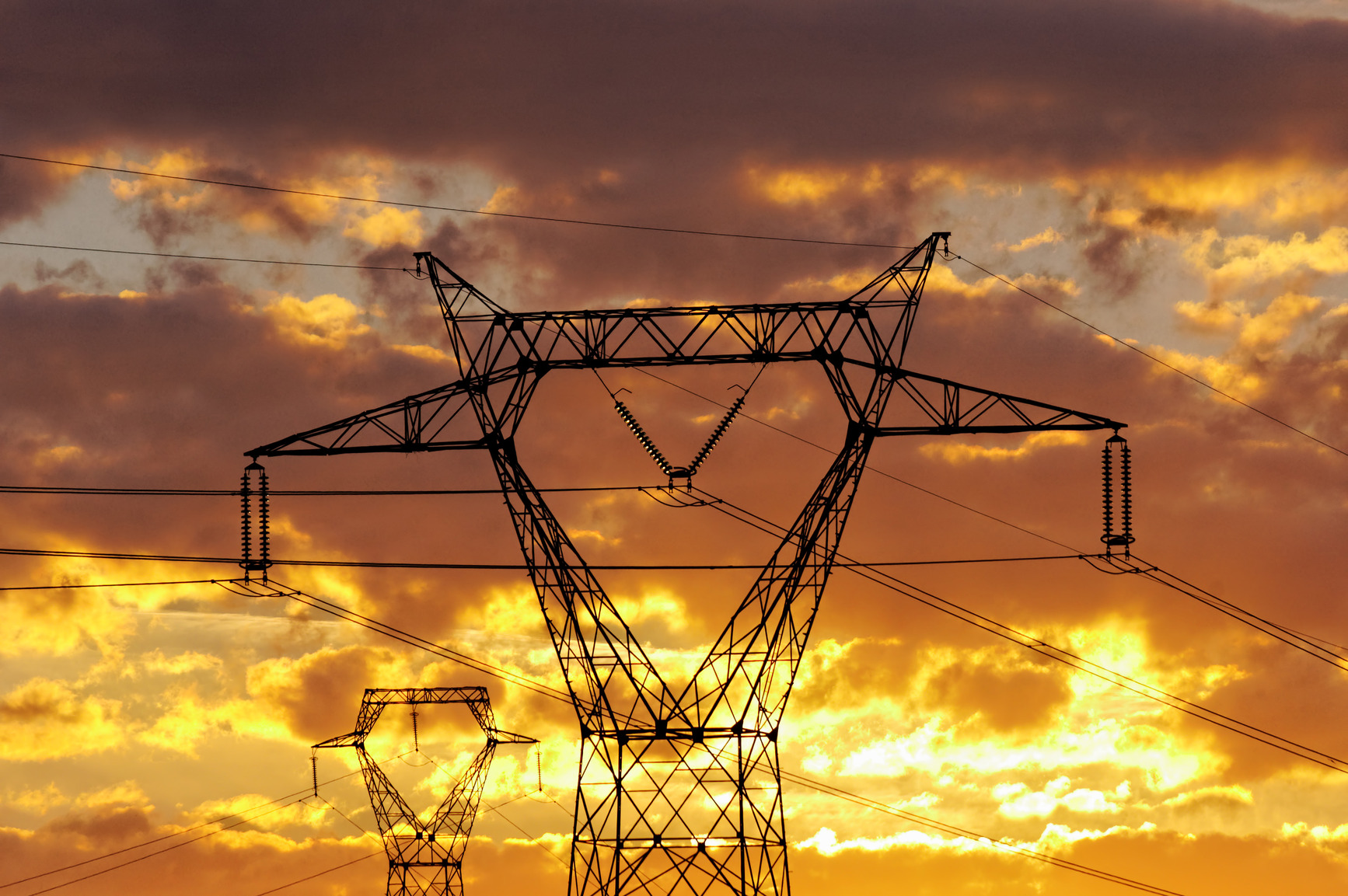 power lines at dusk, yellow sky