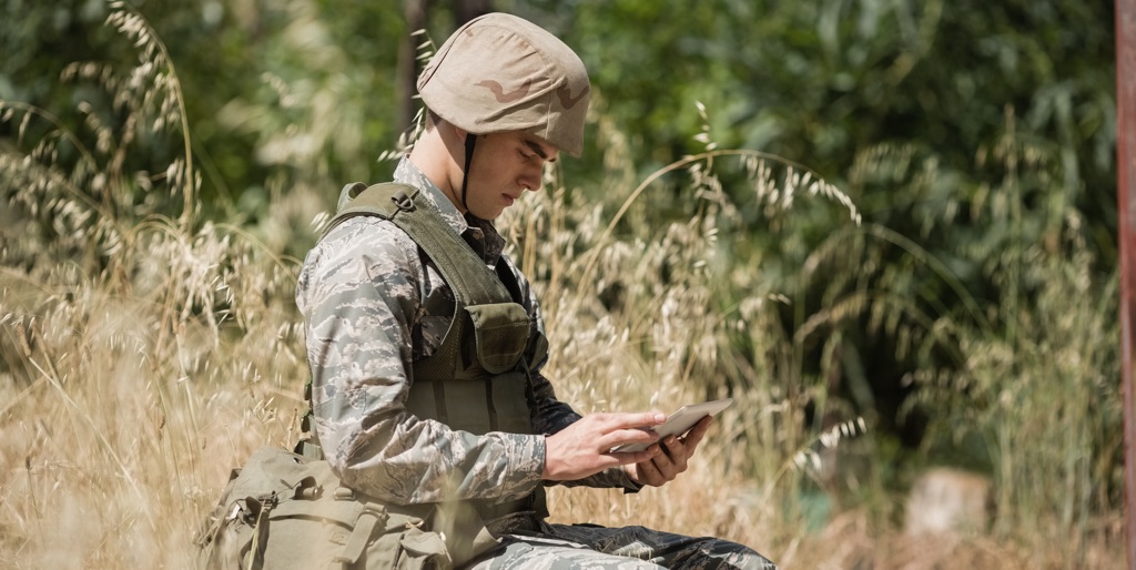 Soldier using tablet in the field